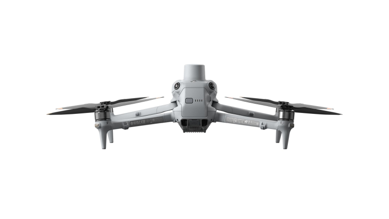 Gray drone with four propellers on a white background