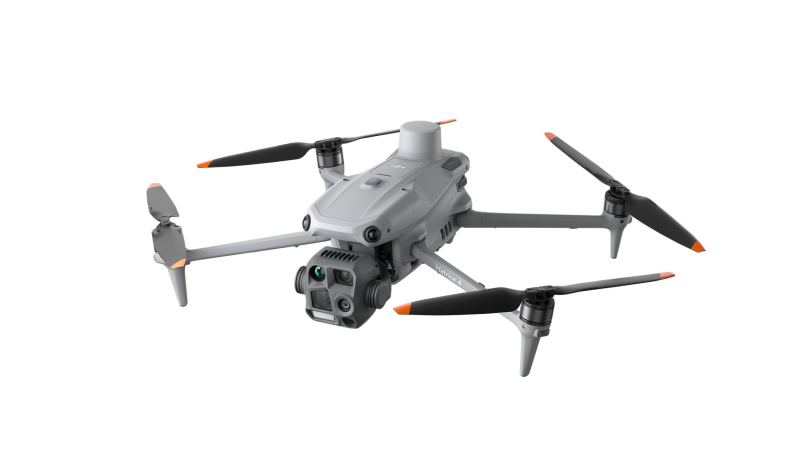Gray drone with four propellers on a white background - DJI M4T Shot from above